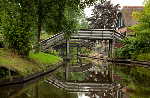 Reflection of Wooden Bridges on Canals of Giethoorn